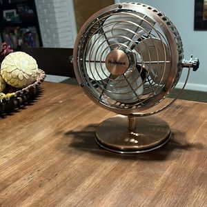 Small decorative metal fan
